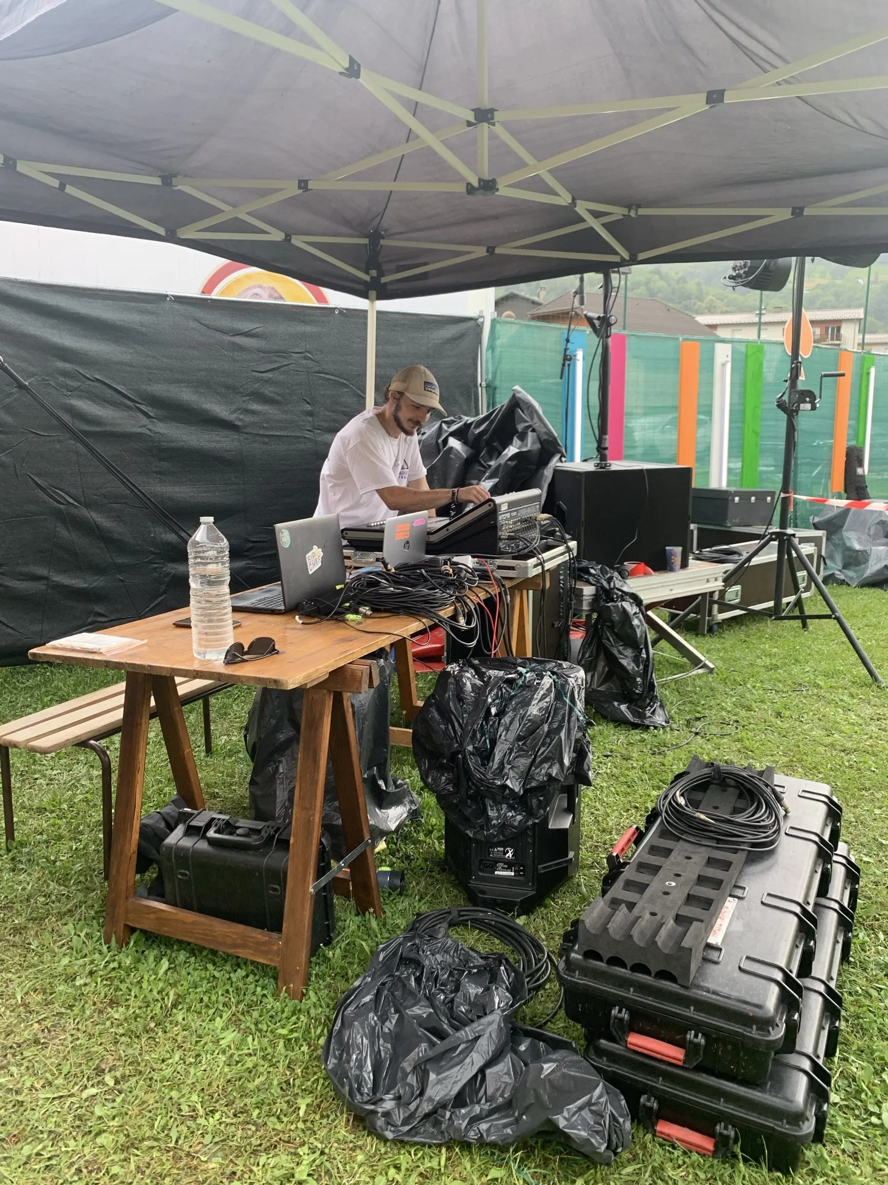 Sound desk set up under a festival tent