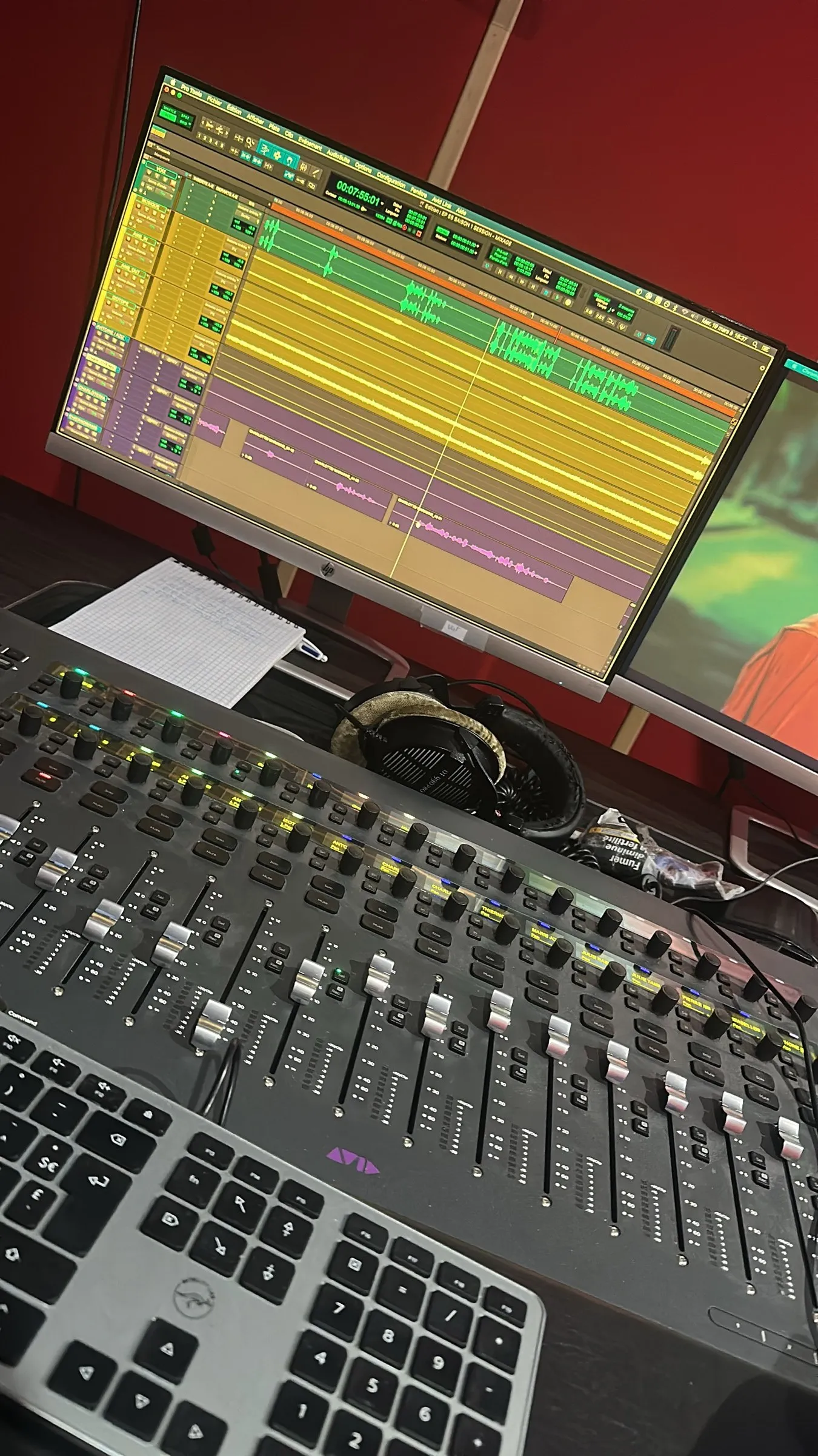 Illuminated mixing console in a studio