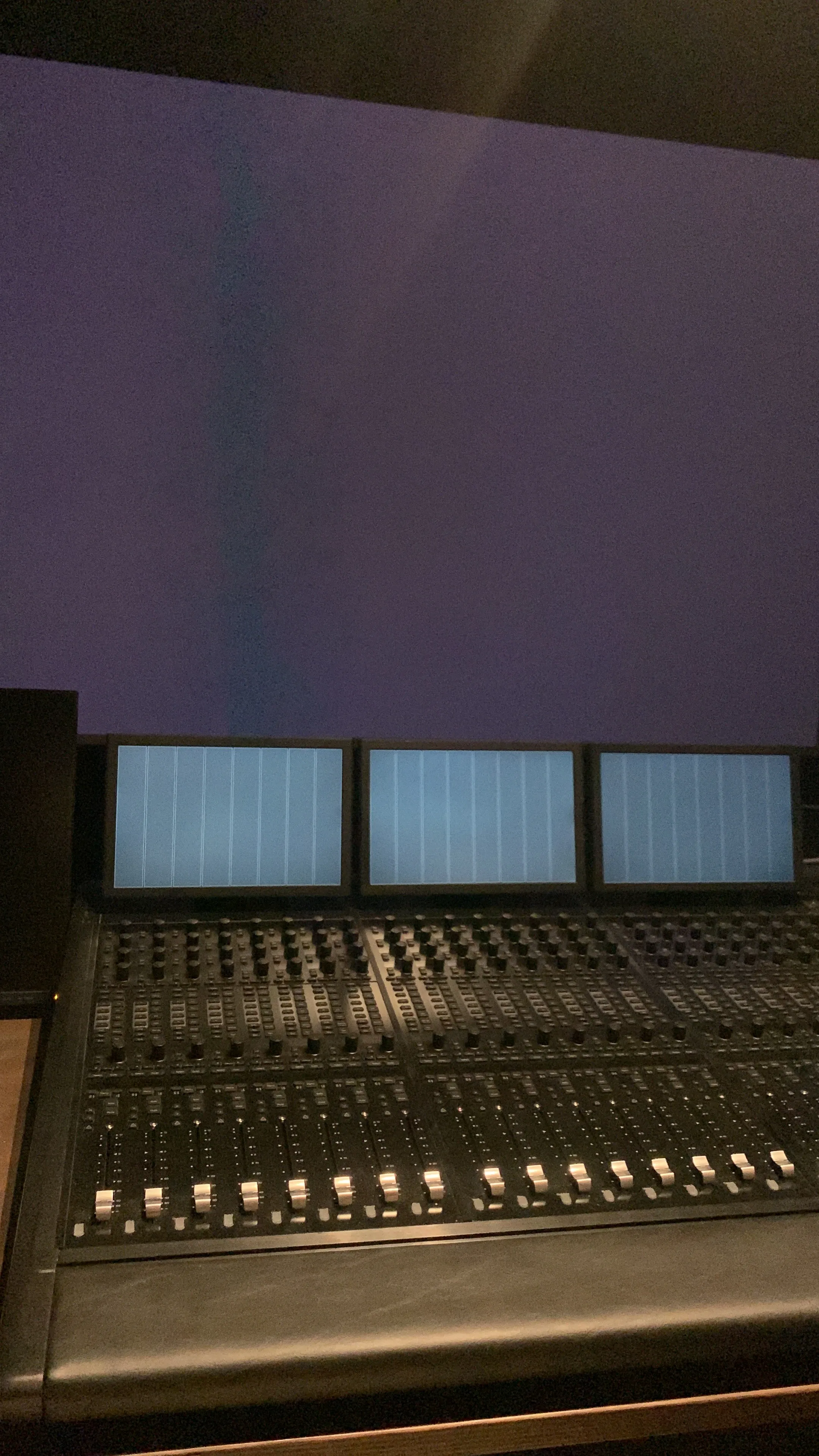Mixing console in a darkened dubbing theatre